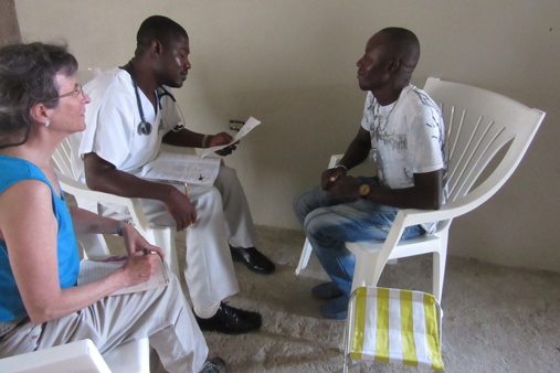 2015 Haiti 22 SE Sante Total clinic Suz S & Alinx w patient 2-t